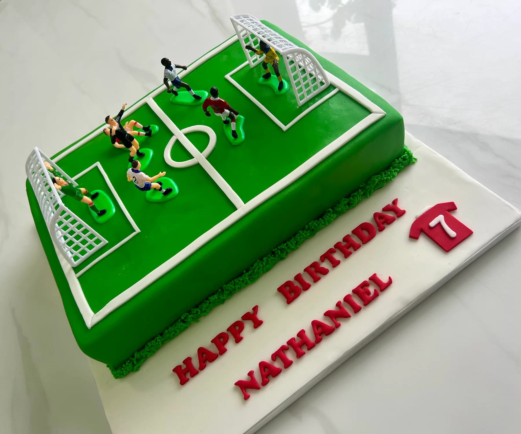 Themed football celebration cake